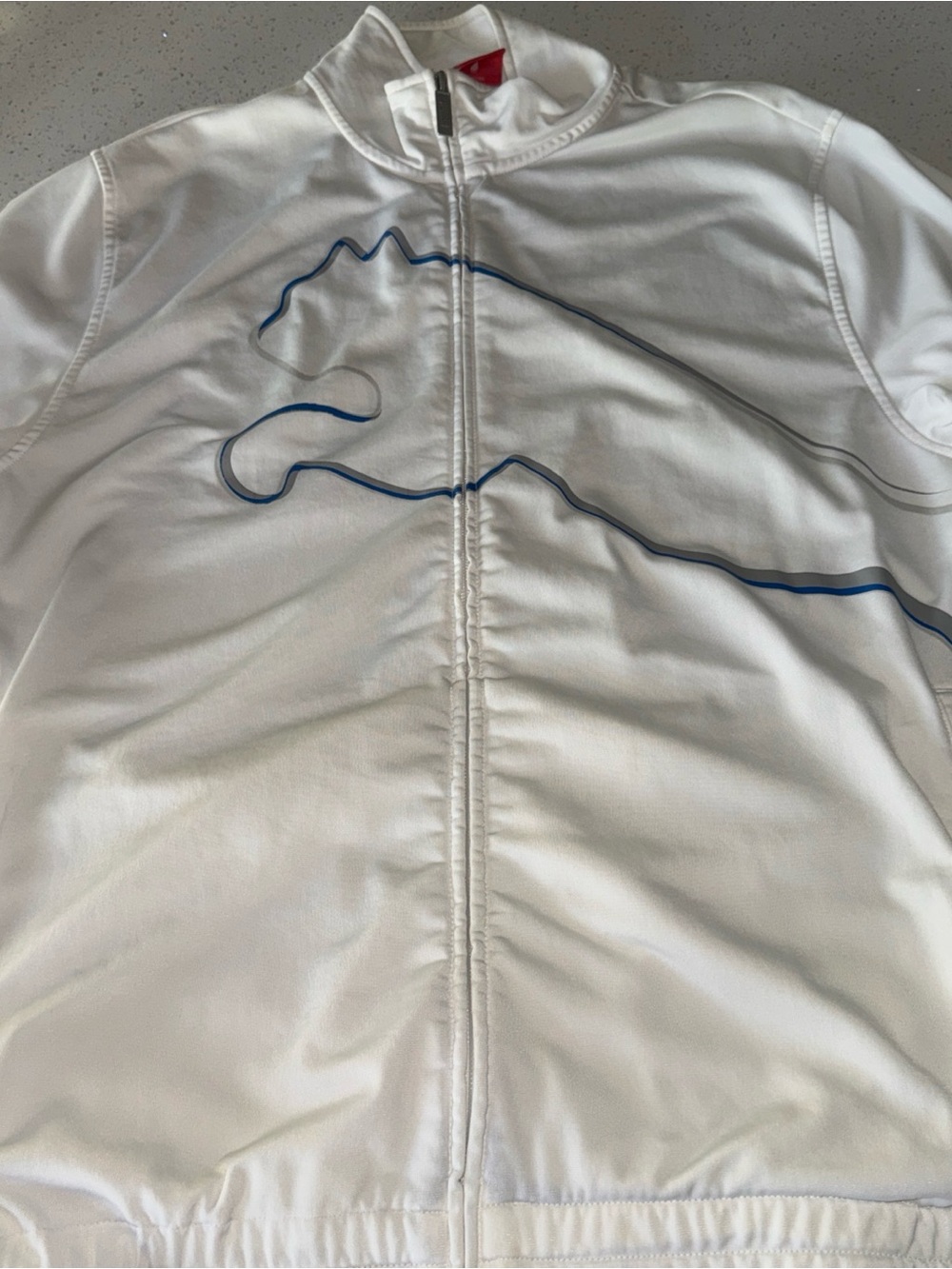 Puma White Jacket with Red Logo Tag and Silver Zipper Pull